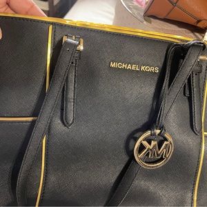 Micheal Kors black & gold purse